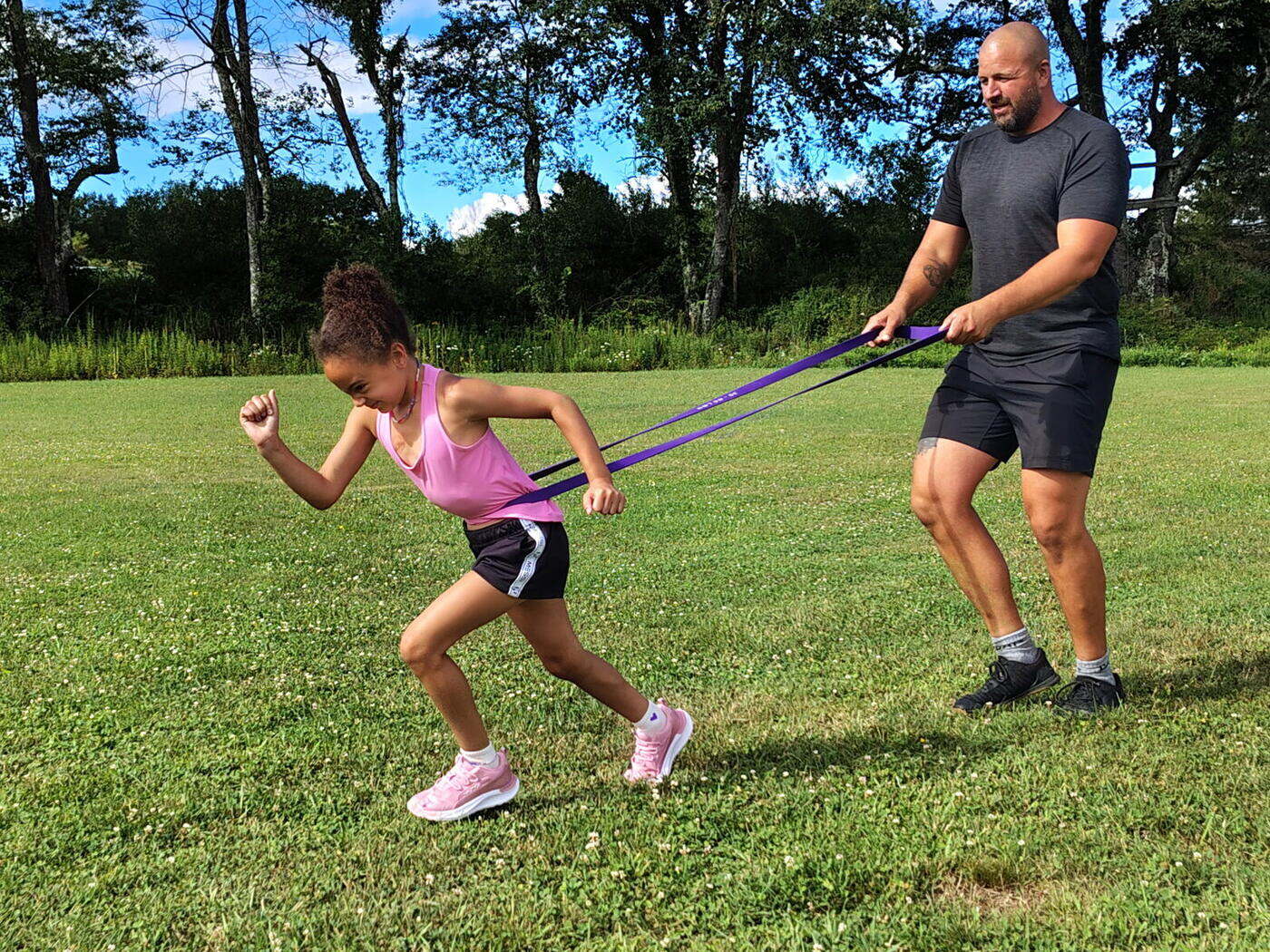 Resisted sprint work out on the grass